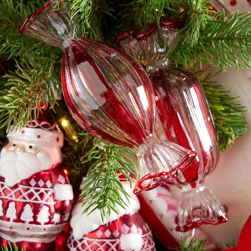 Glass wrapped sweets in red and clear with Santa ornaments