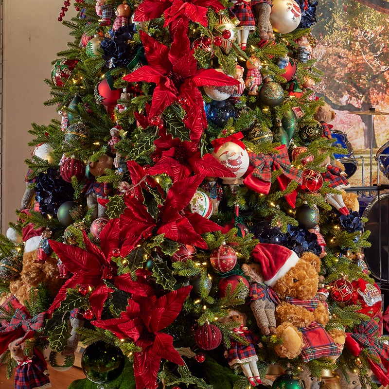 Tree dressed with tartan, poinsettias and classic baubles