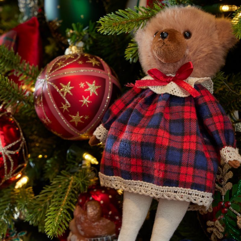 Tartan-dressed bear ornament with red star baubles