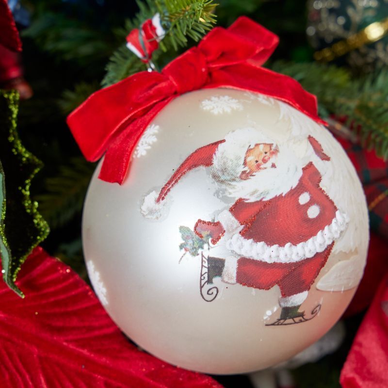 Hand-painted Santa bauble with velvet bow