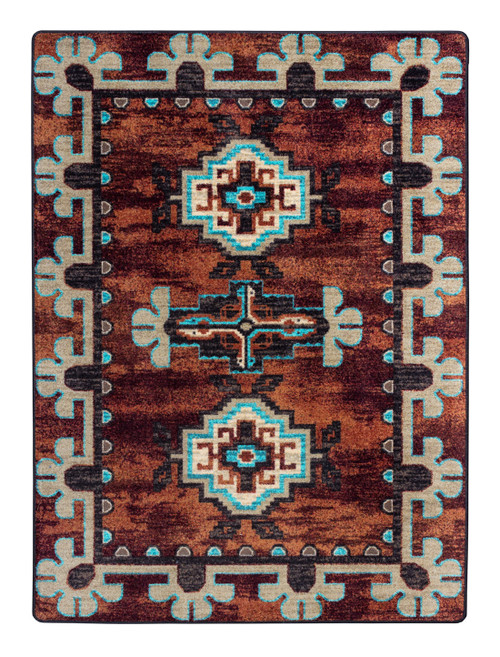 American Dakota Badlands Rust rug with turquoise-accented medallions and pale geometric framing on a weathered red-brown field