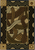 American Dakota Hand Coiled Natural rug with tan, cream and brown looping bands inside a dark wavy border