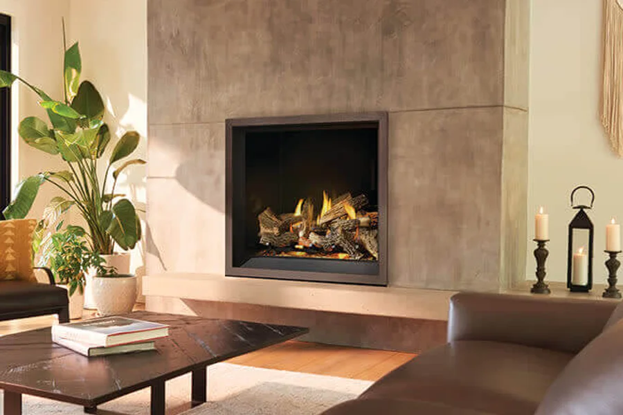 Sunlit living room with a built-in fireplace, concrete surround, and leather seating