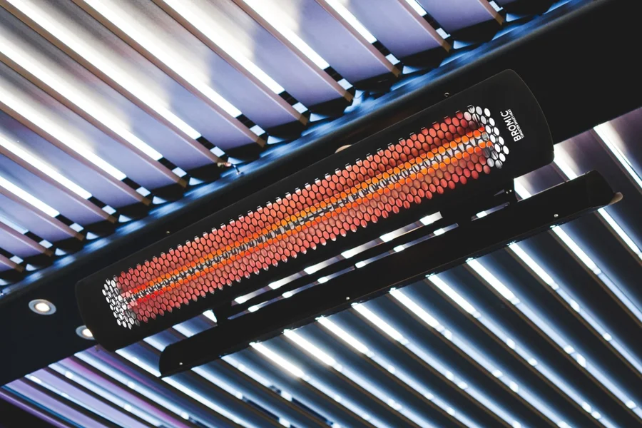Glowing overhead patio heater mounted beneath a slatted pergola roof