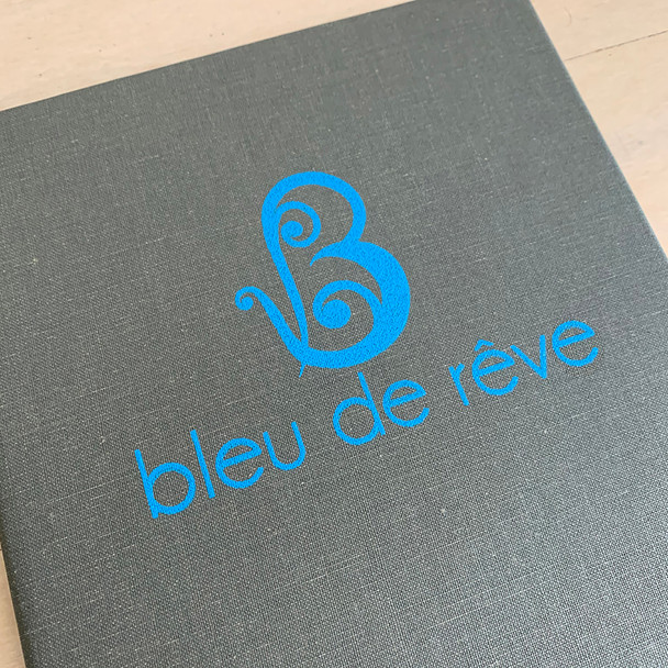 Screenprinted artwork on a Cambridge Linen Dark Grey Menu Cover