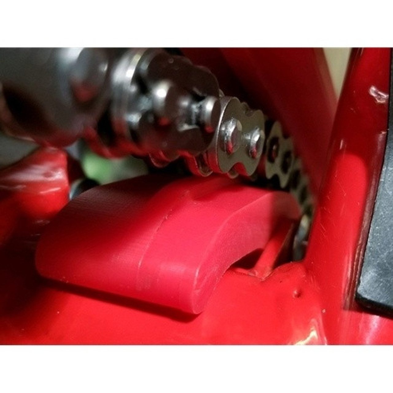 TMDesigns Inner Subframe Protector, Red Inner sub frame guard protects frame & keeps chain running on center Works great with AB-21409 sprocket/case guard Must remove or modify the stock plastic countershaft/case guard Choose from red or black, made in USA