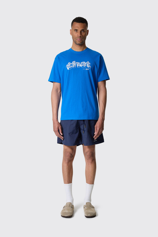 ★thisisneverthat★ that Village Tee Blue TN251TTSST33BLU This Is Never That Village Tee Blue - Calico Club