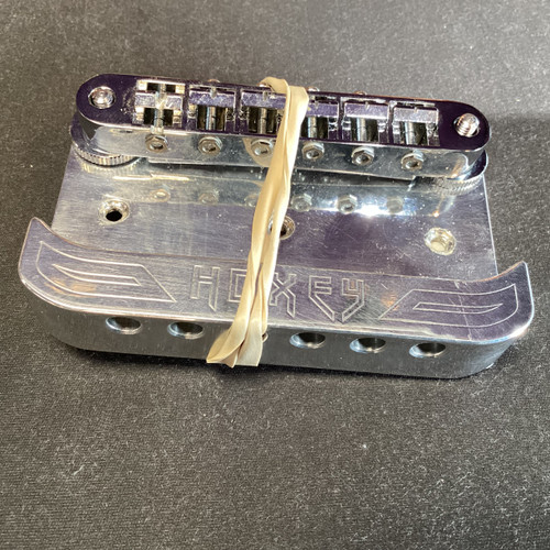 Vist Large View of Product Image Which is Used HOXEY ONE PIECE BRIDGE Guitar Hardware