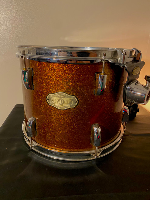 Vist Large View of Product Image Which is Used Pearl VISION 13X9.5 RACK TOM W/ ISS MOUNT Rack Tom Brass Finish 13"