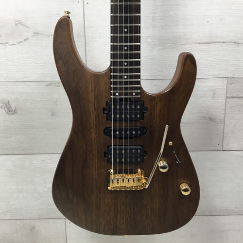 Vist Large View of Product Image Which is Used Charvel MJ DK24 HSH 2PT Mahogany And Walnut Electric Guitar