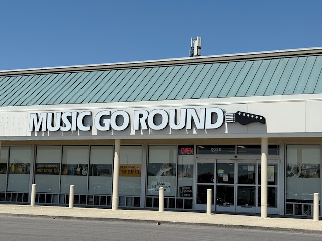 A photo of the front of the Music Go Round on Bethel Road in Columbus, Ohio. Store sign reads Music Go Round: Guitars, Drums, ProSound.