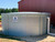 16,000 Gallon - Pioneer Water Storage Tank - Model XL13  with Fascia and installed on sand.