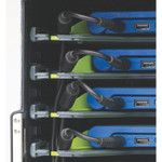 Closeup of charging cords for laptops.