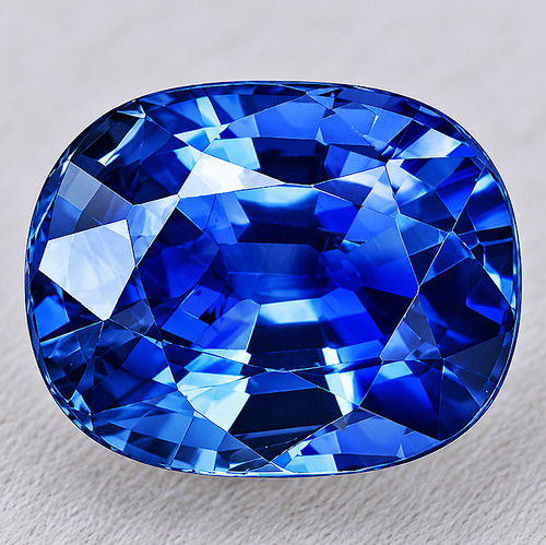 7x5.5 mm { 1.55 cts } Oval AAA Fire Intense AAA Blue Sapphire (Flawless-VVS)--AAA Grade