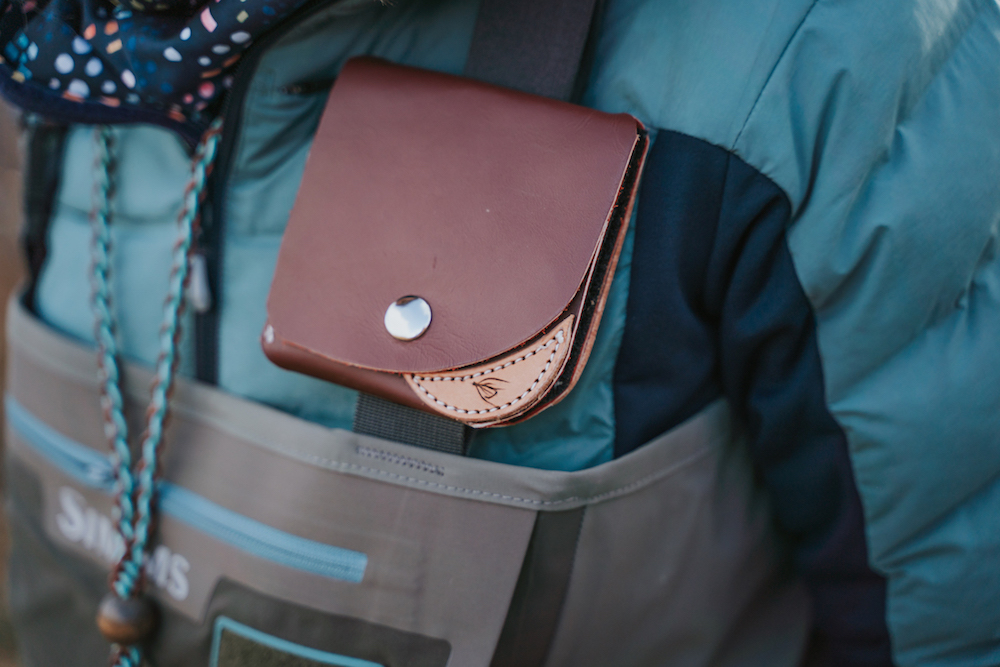 Damsel leather fly wallet shown on a wader strap. 