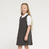 Zeco flower embroidery pinafore in grey, worn, side view, close up