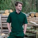 Navy poly cotton work polo shirt with buttoned chest pocket and flat knit collar