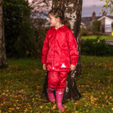 Child's navy waterproof jacket with hood and matching waterproof trousers with reflective triangles