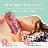 A child holding a pink personalised water bottle with the name Emma