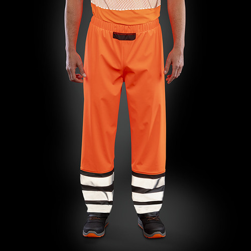 Fluorescent orange waterproof hi vis trousers with black mesh panels and reflective leg bands