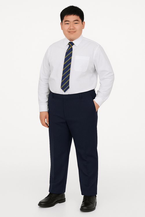 Portrait of a teenage boy wearing navy blue school trousers, white shirt, and striped tie, posed naturally with one hand in his pocket against a white background.