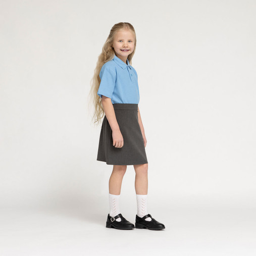 Zeco school polo shirt in sky blue, worn, side view