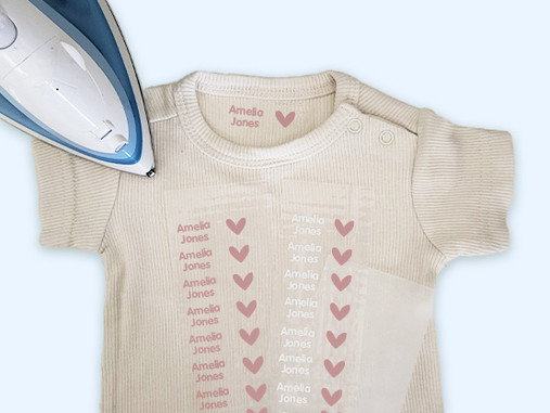 Baby vest with a sheet of Easy2Name iron-on name transfers