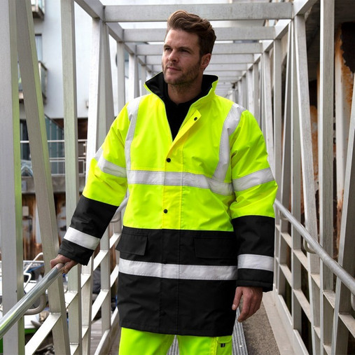 Orange and black 2-tone hi vis coat with reflective bands, storm flap pockets and stand-up collar