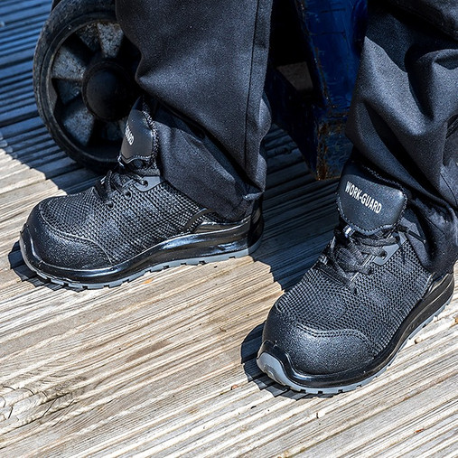 All black safety trainer with steel toecap, leather trim and moulded toe scuff cap