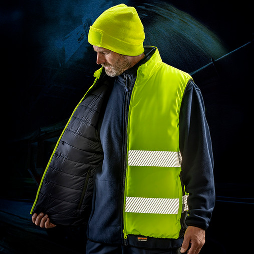 Reversible padded gilet in hi vis orange with reflective bands, navy reverse and stand up collar
