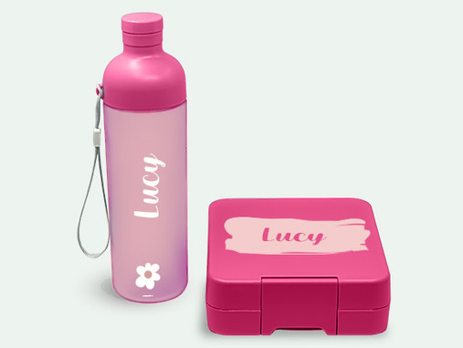 Pink personalised 600 ml drinking bottle named Lucy with a matching pink lunch box