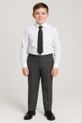 A photograph features a 12-year-old schoolboy dressed in a smart school uniform. He is wearing a crisp white shirt, a striped tie, and grey plus-size school trousers with a tapered fit. The trousers have a classic schoolwear look with an elasticated waistband and clasp fastening, tailored for comfort and durability. The boy stands confidently against a neutral background, showcasing the full fit of the trousers.