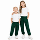 Young boy and girl wearing bottle green school jogging bottoms with elastic waist and cuffed hems
