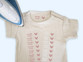 Baby vest with a sheet of Easy2Name iron-on name transfers