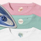 Easy2Name round iron-on name labels in pattern designs, ironed into pink, green and white T-shirts