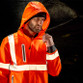 Fluorescent orange and black waterproof hi vis jacket with reflective bands and hood