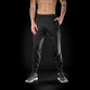 Black mens slim fit joggers with drawcord waist, zipped ankles and grey inner trim
