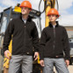 Black heavy duty microfleece work jacket with zip through collar and zipped pockets