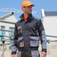 Two-tone lightweight work jacket with bellowed chest pockets, stand up collar and orange tabs
