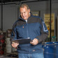 Stretch work jacket with contrast softshell shoulder and sleeve panels and zipped pockets