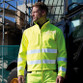 Fluorescent hi vis softshell jacket with reflective tape round the body and sleeves and zip collar