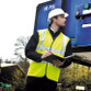 Fluorescent hi vis vest with sewn-on reflective bands and a single vertical tear release front