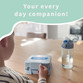 Child at a table with a light blue lunch box named Charlie and a matching water bottle