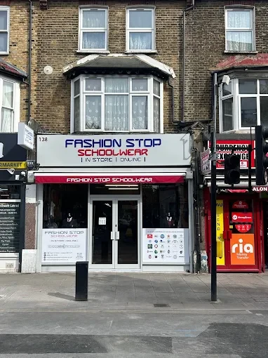 The Fashion Stop Schoolwear shopfront at 138 High Street North, East Ham, with its white and red sign
