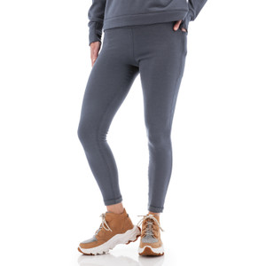 Front view of woman wearing grey Aventura Clothing Dog Walker Fleece Legging, hand in side pocket.