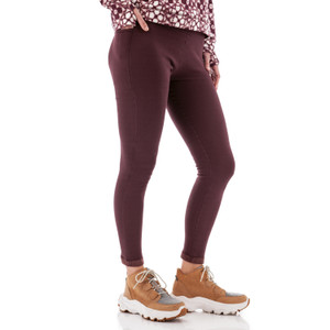 Side view of woman wearing burgundy Aventura Clothing Dog Walker Fleece Legging with side pockets.