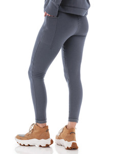Back view of woman wearing grey Aventura Clothing Dog Walker Fleece Legging paired with boots.