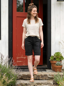 Woman walking down steps wearing Arden V2 Short in black.