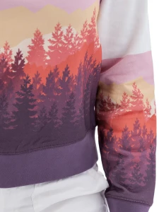 Close-up of white Aventura Clothing Alpine Glow Sweatshirt with pink, orange, and purple sunset mountain print.