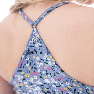 Close-up detail shot of the Linden Strappy Floral Tank Top, focusing on the texture of the slub knit fabric and the overlapping strappy detail at the center of the chest.